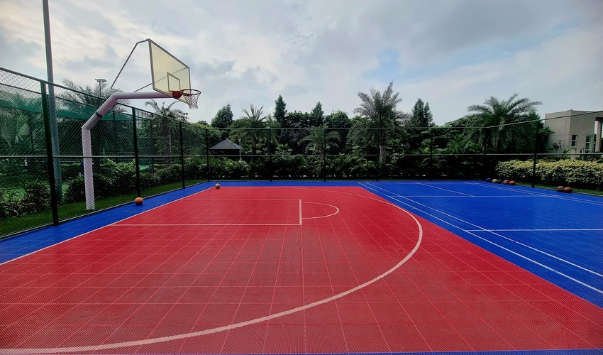Players in acrylic basketball courts
